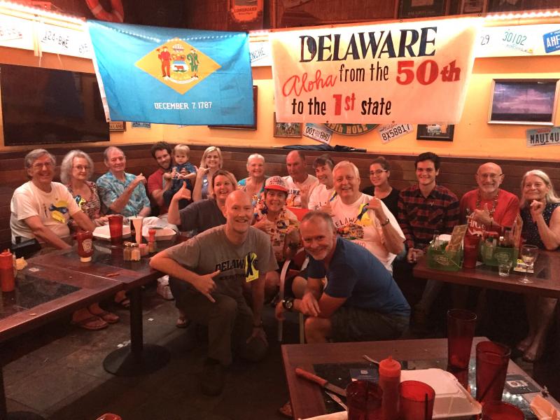 Guests at the Dec. 8, 2016 Hawaiian party with Delaware ties include in back (l-r) Dr. Charles Hill, Martha Hill, Lenny Parsons, James Crowe, Jimmy Crowe, Amy Hill-Crowe, Sue Hill, Hank McDermott, Cathy Weber, Moritz Leiendecker, Bob DeNigris and Linda Letson. In the middle, Nancy Hill, Adele Rugg and Joe Weber. In front, Gerry Smith and Ted King.